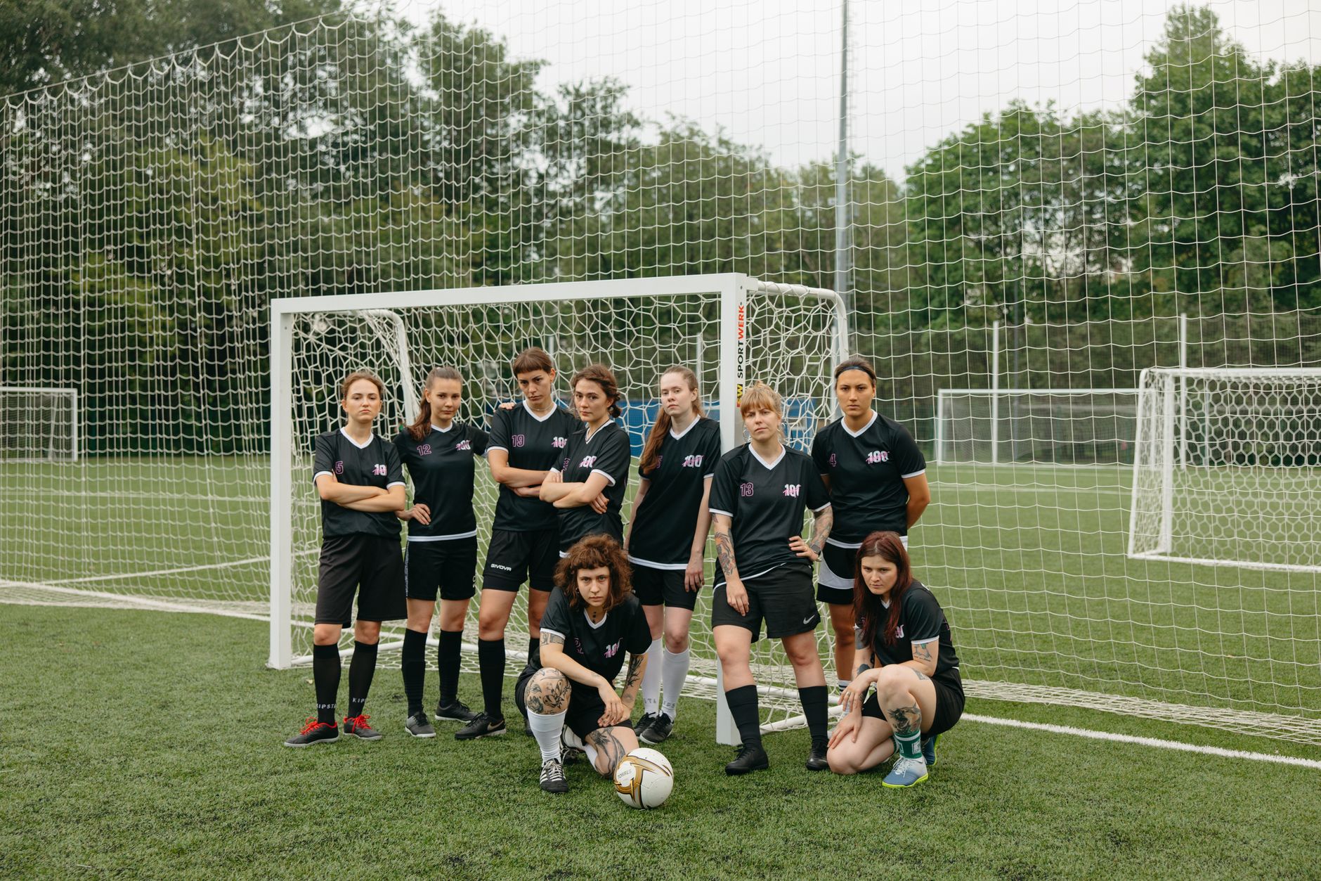 women soccer players near the goal post